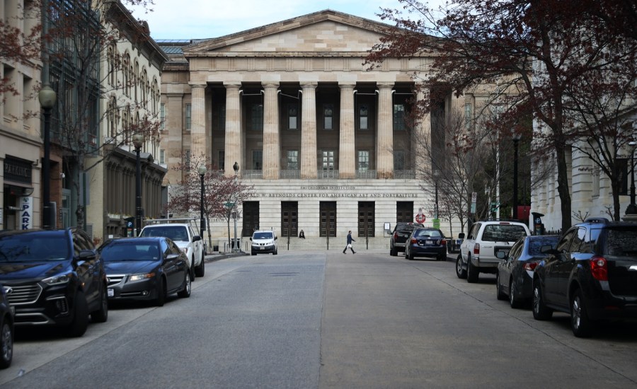 The Smithsonian National Portrait Gallery stands in the Penn Quarter neighborhood of the District of Columbia, which is unusually empty of vehicle traffic and pedestrians due to the coronavirus outbreak