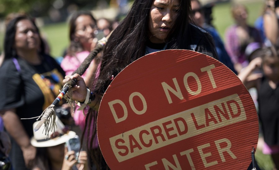 Members of the San Carlos Apache Nation and other activists gathered to protest the a section of the National Defense Authorization Act that would turn over parts of Oak Flat that are sacred to the Apache to a foreign copper mining company.
