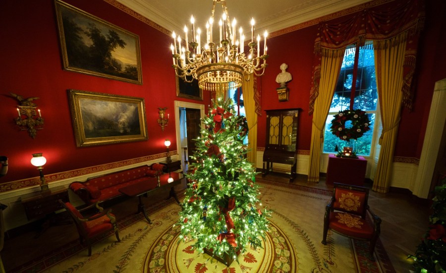 A Christmas tree and decorations are on display in the Red Room of the White House on November 30, 2020 in Washington, DC. This year's theme for the White House Christmas decorations is "America the Beautiful."