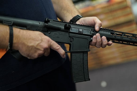 A customer handles an AR-15