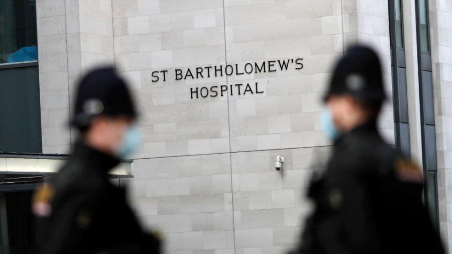 Police officers stand guard outside the St Bartholomew's Hospital where Prince Philip, Duke of Edinburgh is currently receiving treatment on March 01, 2021 in London, England.