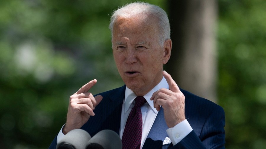 President Biden speaks with reporters outside the White House