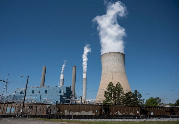 Steam rises from the Miller coal Power Plant in Adamsville, Alabama