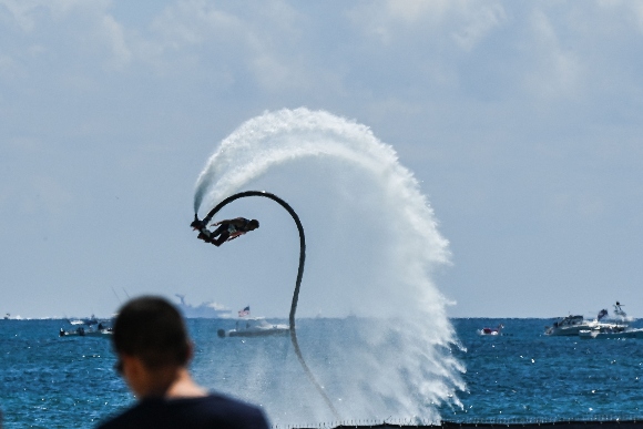 A man performs on a Flyboard during the Memorial Day Hyundai Air and Sea Show in Miami Beach