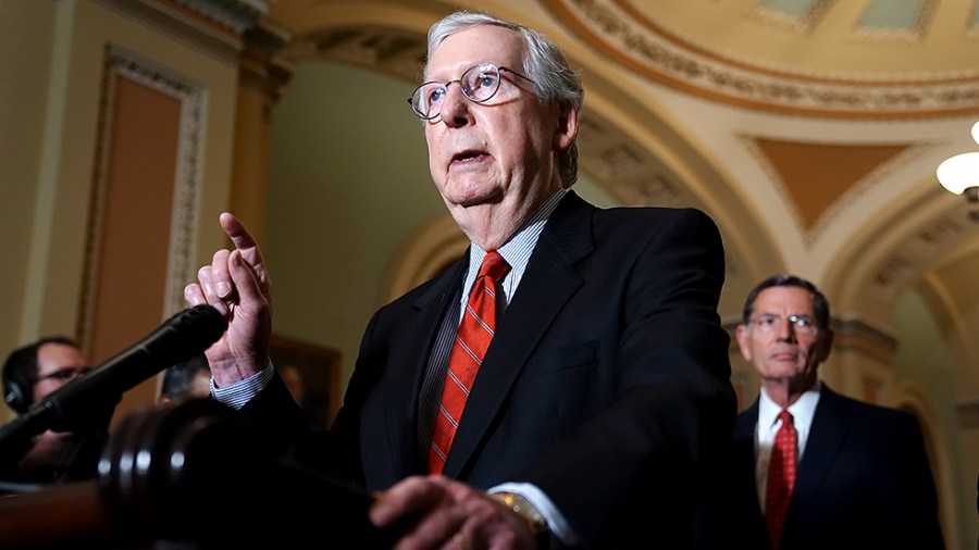 Minority Leader Mitch McConnell (R-Ky.) addresses reporters following the policy luncheon on June 15