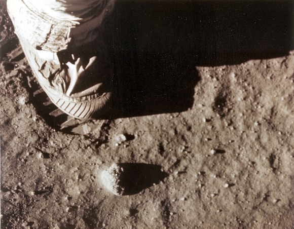 Apollo 11 commander Neil Armstrong's right foot leaves a footprint in the lunar soil