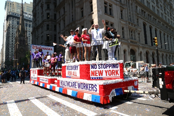 Health Care workers walk during the "Hometown Heroes" Ticker Tape Parade