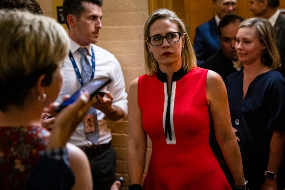 Sen. Kirsten Sinema (D-AZ) heads back to a bipartisan meeting on infrastructure