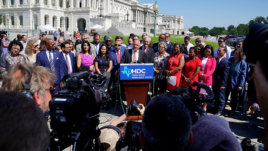 Texas House Democrats address reporters at the U.S. Capitol on July 13 after leaving the state to prevent a strong voting bill to be passed in the state house.