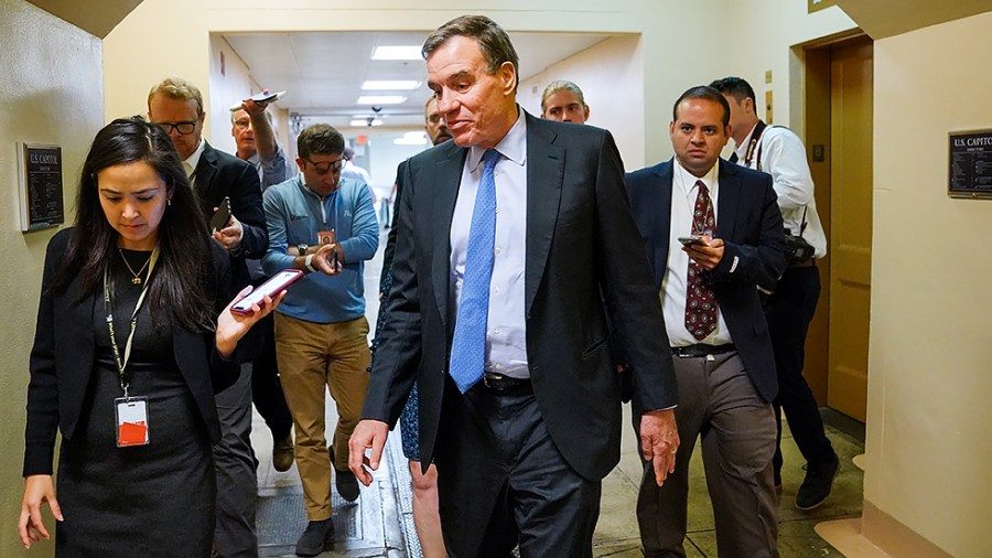 Sen. Mark Warner (D-Va.) speaks to reporters as he arrive for a vote on Monday, July 19, 2021.