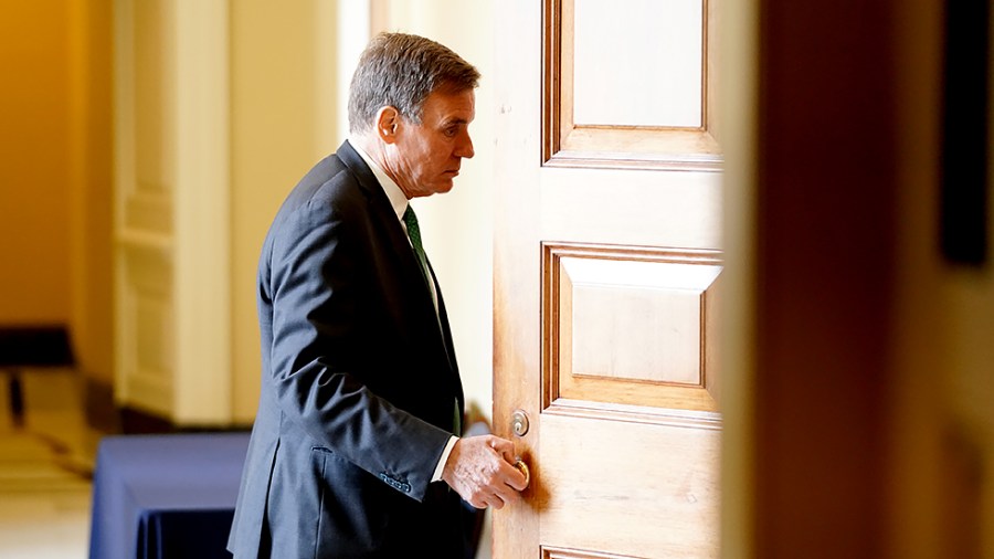 Sen. Mark Warner (D-Va.) arrives for the weekly Senate Democratic policy luncheon on Tuesday, July 20, 2021.