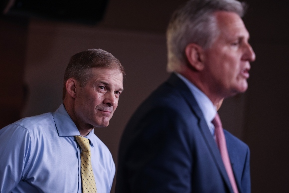 U.S. Rep. Jim Jordan (R-OH) (L) listens as House Minority Leader Kevin McCarthy (R-CA) speaks at a news conference