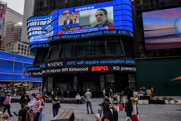 A screen in Times Square shows news coverage of New York Governor Andrew Cuomo following revelations over allegations of sexual harassment