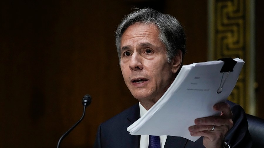 Secretary of State Antony Blinken holds up documents as he testifies during a Senate Foreign Relations Committee hearing on September 14, 2021. Blinken was questioned about the Biden administration's handling of the U.S. withdraw from Afghanistan