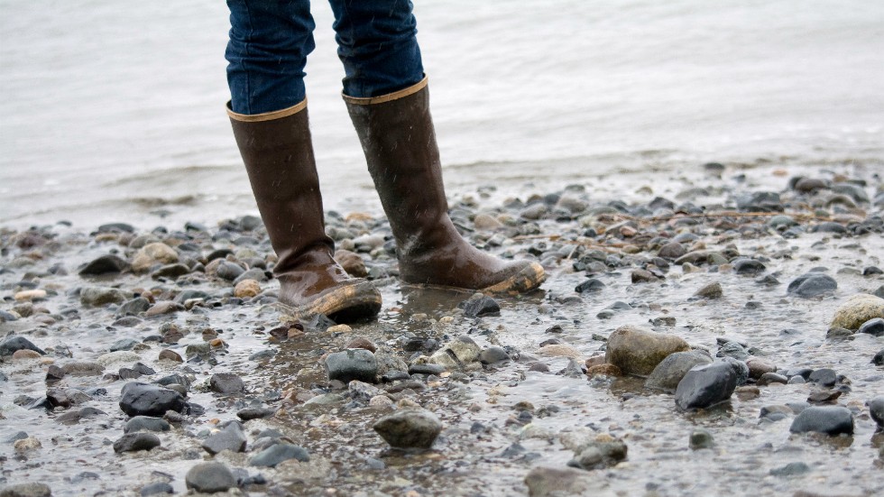 Boots mud feet rocks water Alaska