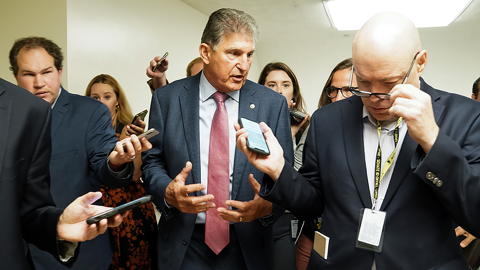 Sen. Joe Manchin (D-W.Va.) speaks to reporters as he arrives for a vote and a meeting with Democrats from the Texas State House on Thursday, July 15, 2021.