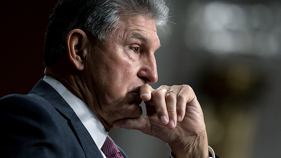 Sen. Joe Manchin (D-W.Va.) pauses during a Senate Armed Services Committee hearing at the Dirksen Senate Office building in Washington on Tuesday, September 28, 2021