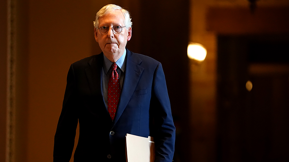 Minority Leader Mitch McConnell (R-Ky.) walks towards the Senate Chamber prior a cloture vote to fund the government and suspend the debt ceiling on Monday, September 27, 2021.