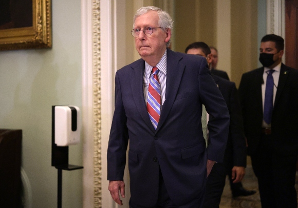 Senate Minority Leader Sen. Mitch McConnell (R-KY) approaches members of the press for a briefing