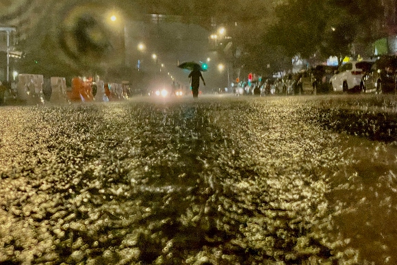  A person makes their way in rainfall from the remnants of Hurricane Ida in the Bronx