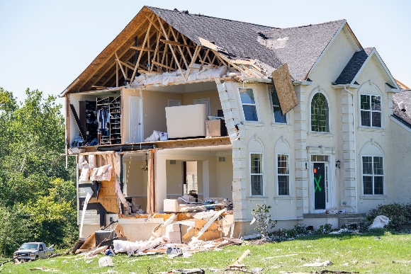 A home damaged by a tornado is seen in Mullica Hill , New Jersey