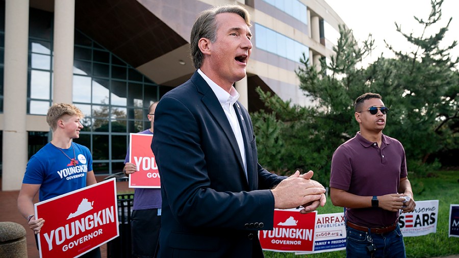 Virginia Republican gubernatorial candidate Glenn Youngkin greets voters after casting his ballot during early voting at the Fairfax County Government Center in Fairfax, Va., on Thursday, September 23, 2021.