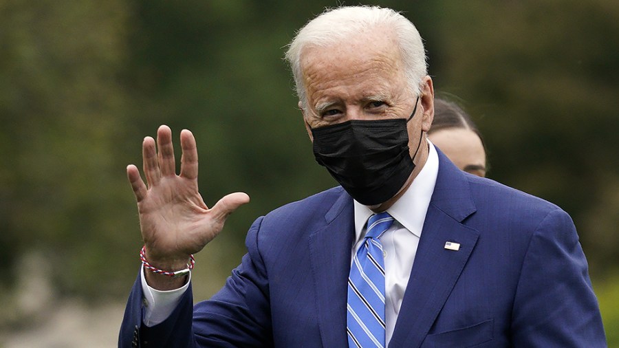 President Biden waves as he walks on the South Lawn of the White House upon his return to Washington, D.C., after the weekend in Delaware on October 11, 2021.