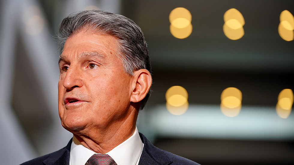 Sen. Joe Manchin (D-W.Va.) makes a statement outside his office in the Hart Senate Office Building regarding the bipartisan infrastructure plan and other agenda items on Wednesday, October 6, 2021.