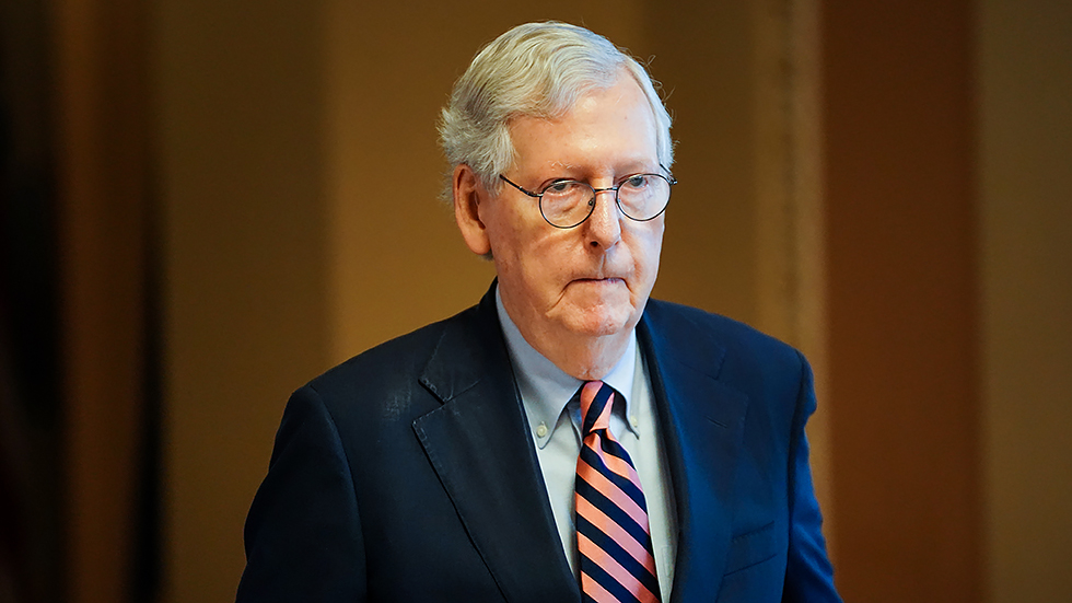 Minority Leader Mitch McConnell (R-Ky.) heads to the Senate Chamber on Monday, October 4, 2021 to give opening remarks.