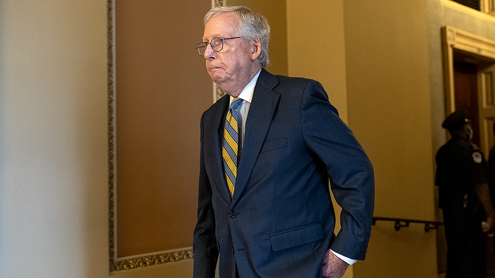 Minority Leader Mitch McConnell (R-Ky.) heads to the Senate Chamber for a nomination vote on Wednesday, October 6, 2021 as the Senate negotiates a debt ceiling deal.