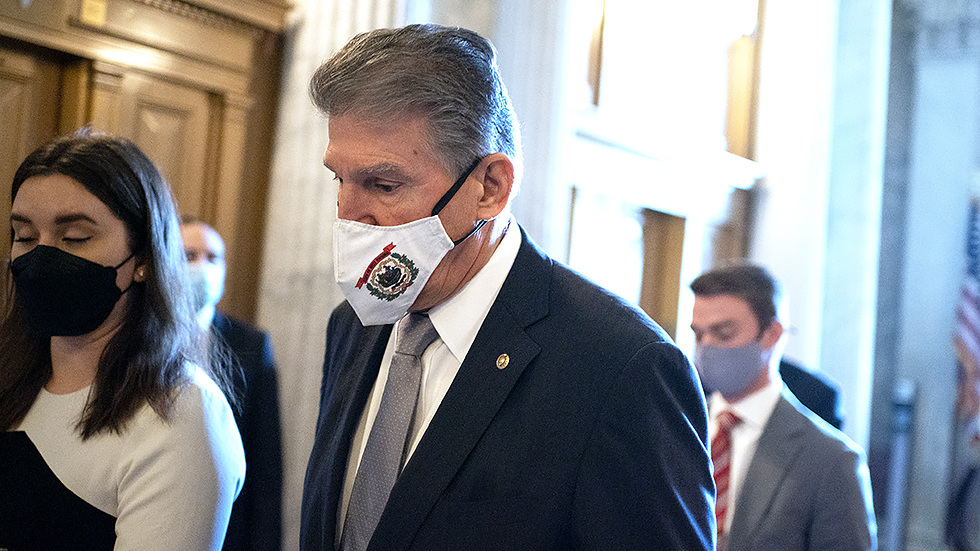 Sen. Joe Manchin (D-W.Va.) arrives to the Senate Chamber for a nomination vote on Wednesday, November 3, 2021.