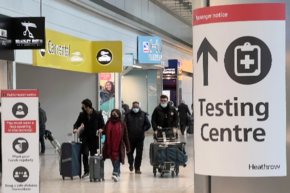 Passengers arrive at Heathrow Airport in London