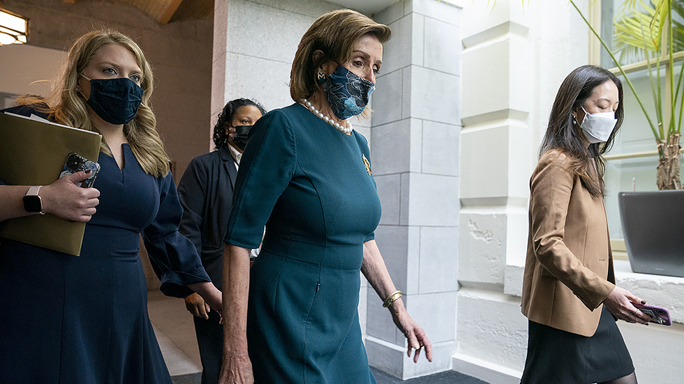 Speaker Nancy Pelosi (D-Calif.) returns to a House Democratic Caucus meeting where they are discussing the Build Back Better agenda and the bipartisan infrastructure deal on Thursday, October 28, 2021.