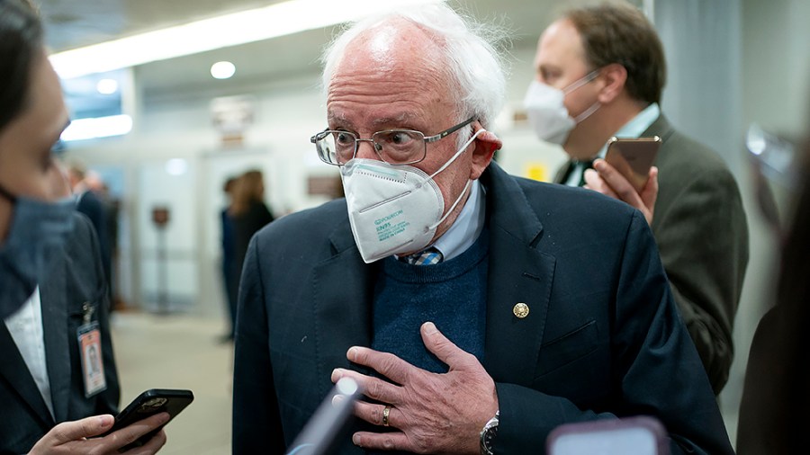 Sen. Bernie Sanders (I-Vt.) speaks to reporters as he arrives to the Capitol for a vote on Wednesday, November 17, 2021.