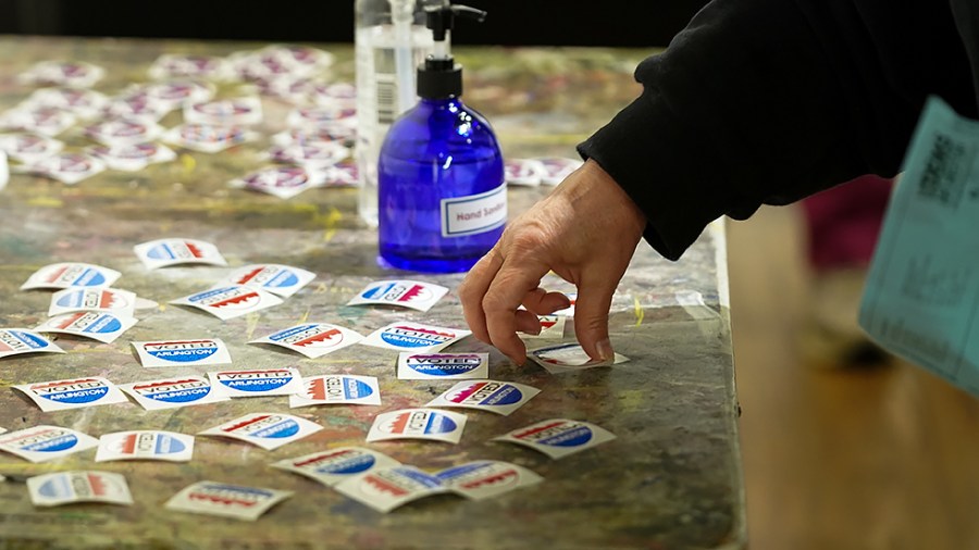 Stickers are seen at the Arlington Arts Center in Arlington, Va., on Tuesday, November 2, 2021. Virginia is voting for governor, state house and senate races.