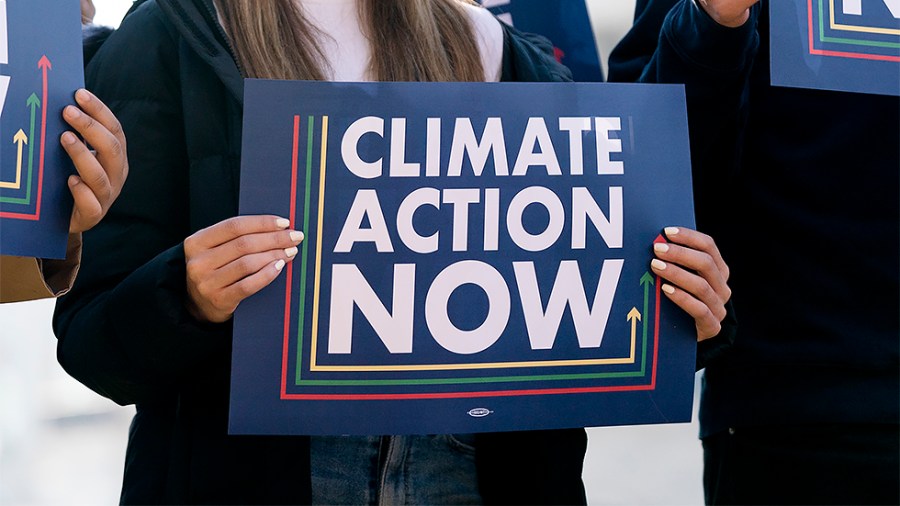 Climate advocates are seen during a press conference on Wednesday, December 1, 2021 to discuss climate change provisions in the Build Back Better Act.