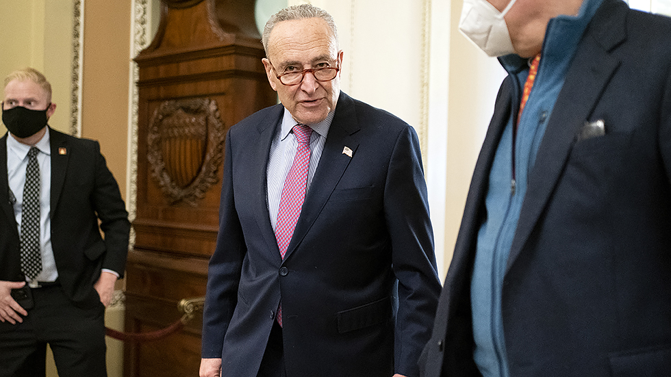 Sens. C Schumer (D-N.Y.) and S Whitehouse (D-R.I.) leave a Senate Democratic luncheon on Friday, December 17, 2021 to discuss the way forward on the legislative agenda.