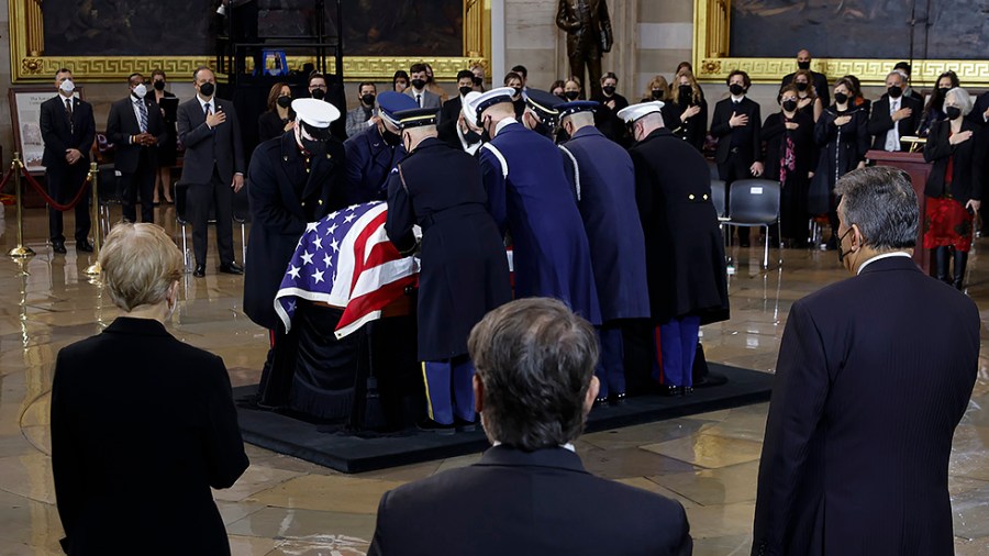 A military honor guard place the casket of former Sen. Harry Reid (D-Nev.) into the U.S. Capitol Rotunda on January 12, 2022.