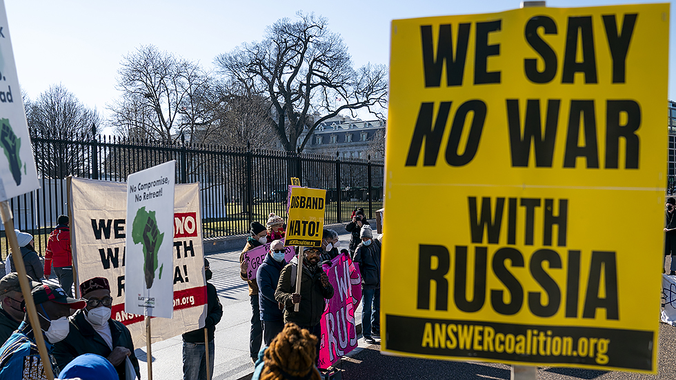 Protesters from multiple groups gather outside the White House to rally against any potential war in Russia with Ukraine on Thursday, January 27, 2022.