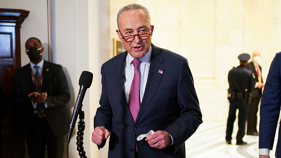 Majority Leader C. Schumer (D-N.Y.) speaks to reporters after hearing from President Biden at a Democratic caucus luncheon at the Senate Russell Office building to discuss voting rights and filibuster reform on Thursday, January 13, 2022.