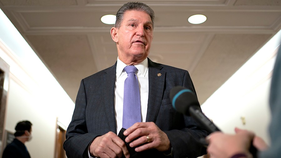 Sen. Joe Manchin (D-W.Va.) speaks to reporters before a Senate Energy and Natural Resources Committee nomination hearing on Tuesday, February 8, 2022 including nominee Laura Daniel-Davis to be an Assistant Secretary of the Interior.