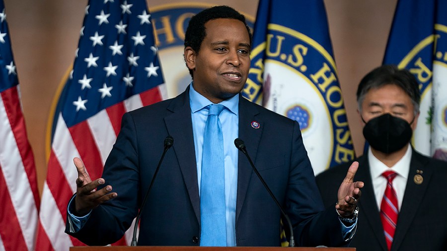 Rep. Joe Neguse (D-Colo.) addresses reporters after a closed-door Democratic caucus meeting on Wednesday, February 2, 2022.