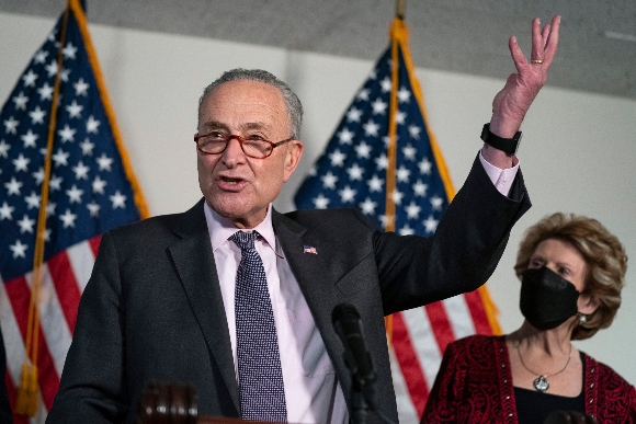 Sen. Debbie Stabenow, D-Mich., listens as Senate Majority Leader Sen. Chuck Schumer of N.Y. speaks