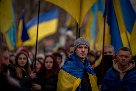 Demonstrators march along the street in Odessa, Ukraine