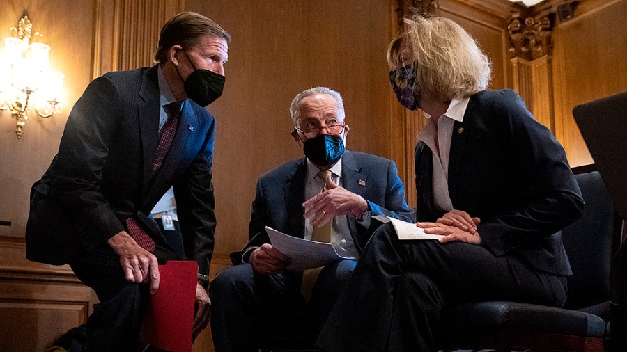 Sens. Richard Blumenthal (D-Conn.), Charles Schumer (D-N.Y.) and Tammy Baldwin (D-Wis.) chat before a press conference on Monday, February 28, 2022 to discuss the Women’s Health Protection Act prior to its’ vote.