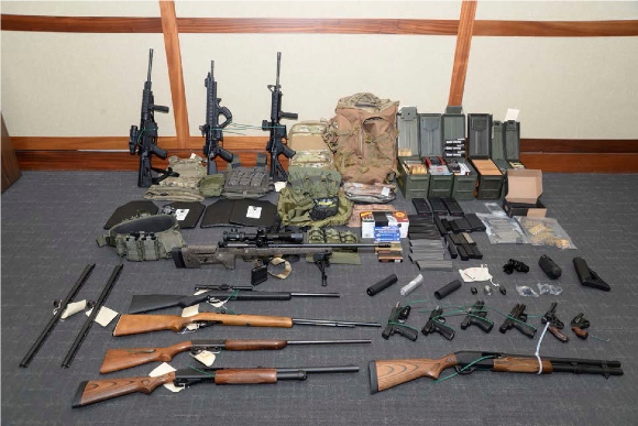 This file image provided by the Maryland U.S. District Attorney's Office shows a photo of firearms and ammunition that belonged to Christopher Paul Hasson