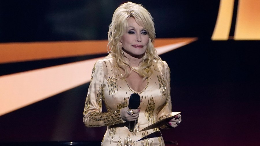 Dolly Parton presents the award for entertainer of the year at the 57th Academy of Country Music Awards