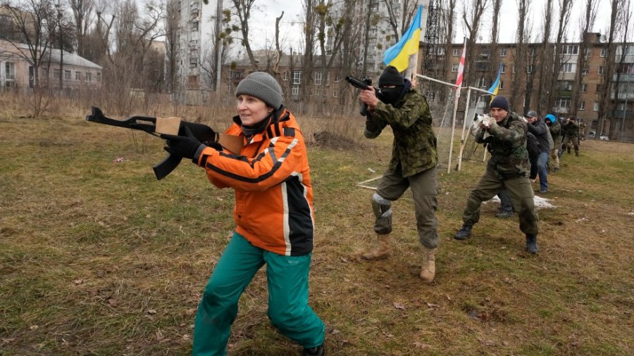 Civilians train with members of the Georgian Legion, a paramilitary unit formed mainly by ethnic Georgian volunteers to fight against Russian forces in Ukraine