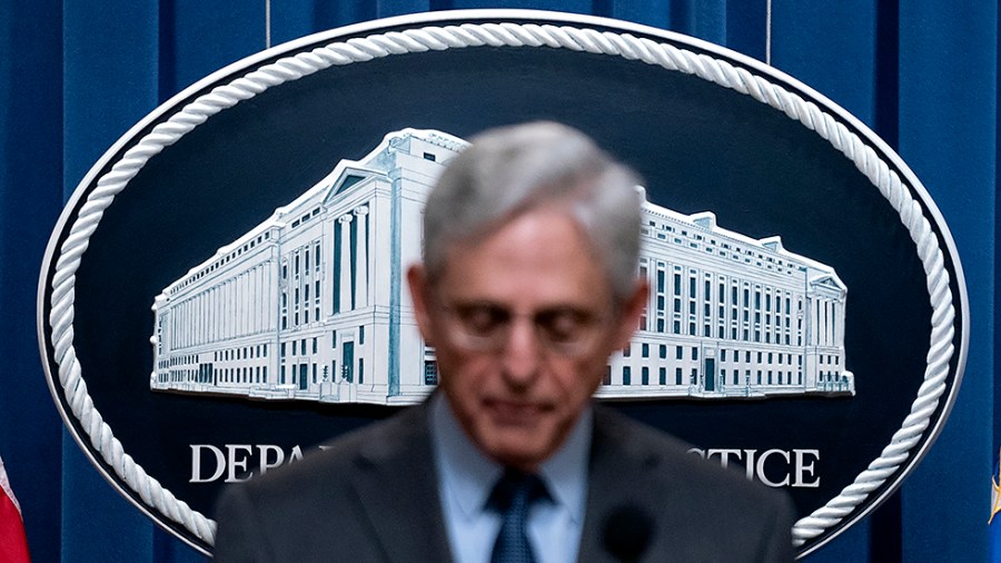 A logo of the Department of Justice is seen at their headquarters in Washington, D.C., on Friday, April 1, 2022.