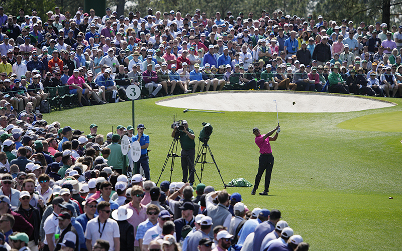 Tiger Woods tees off